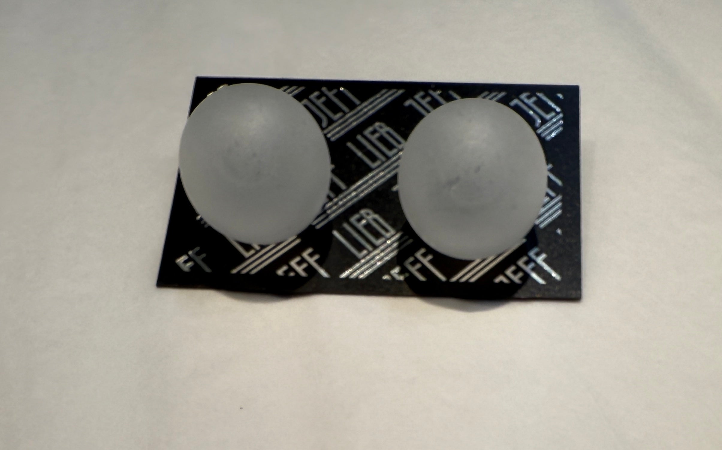 Ice Ball Clip On Earrings by Jeff Lieb