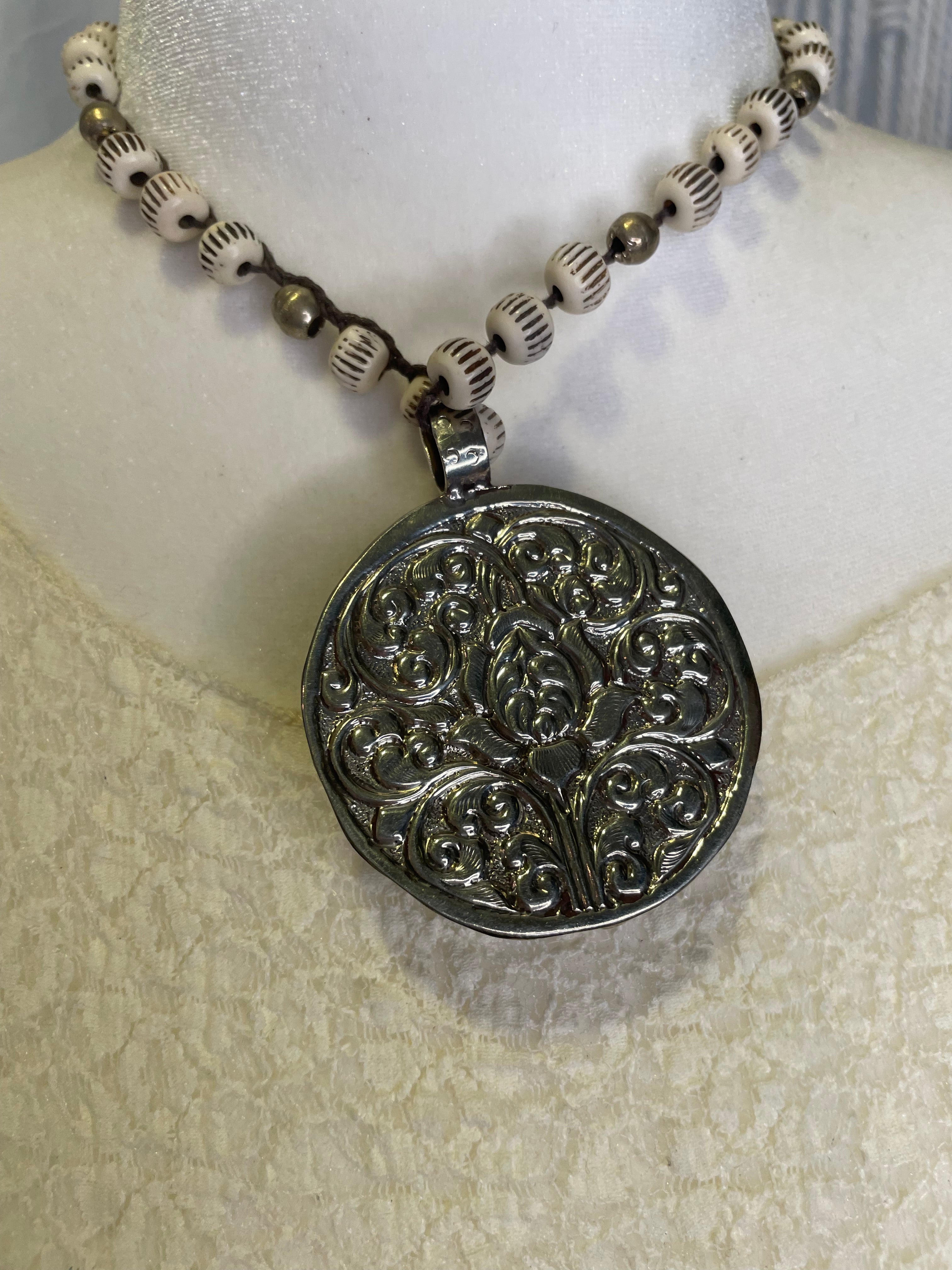 Celestial Faces Carved in Bone Necklace by Tara Gasparian