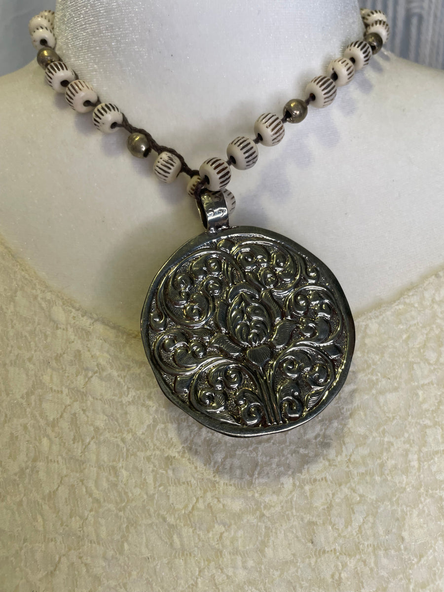 Celestial Faces Carved in Bone Necklace by Tara Gasparian